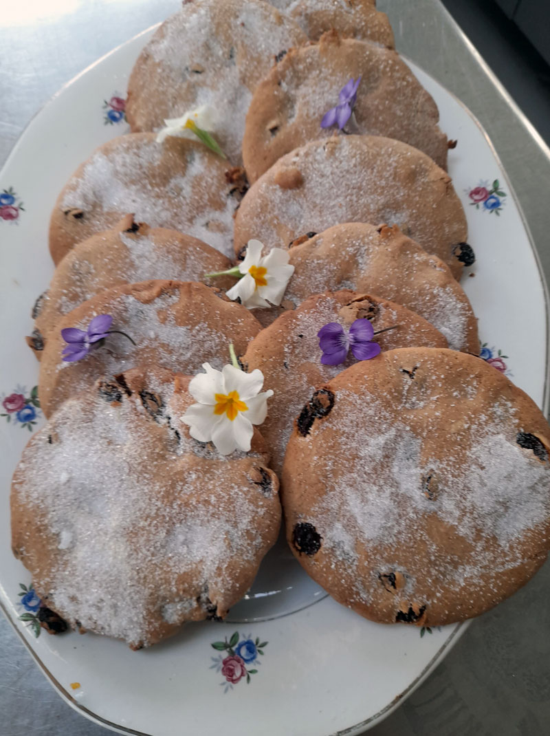 delicious cookies on a plate decorated with spring flowers