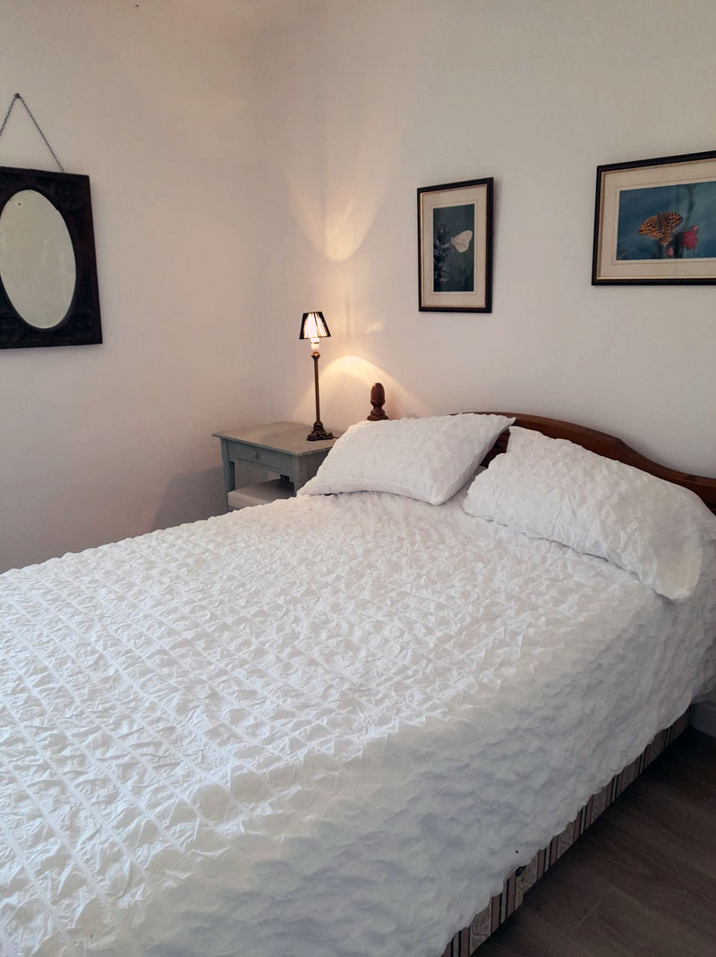 comfortable double bed in bright airy room near Chef Boutonne